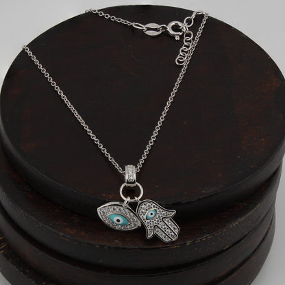 Collar con Colgante Mano de Fátima y Ojo Turco. Plata de Ley.  Baño Rodio. Zirconitas. Cadena Forzatina CL1314799R - Henor